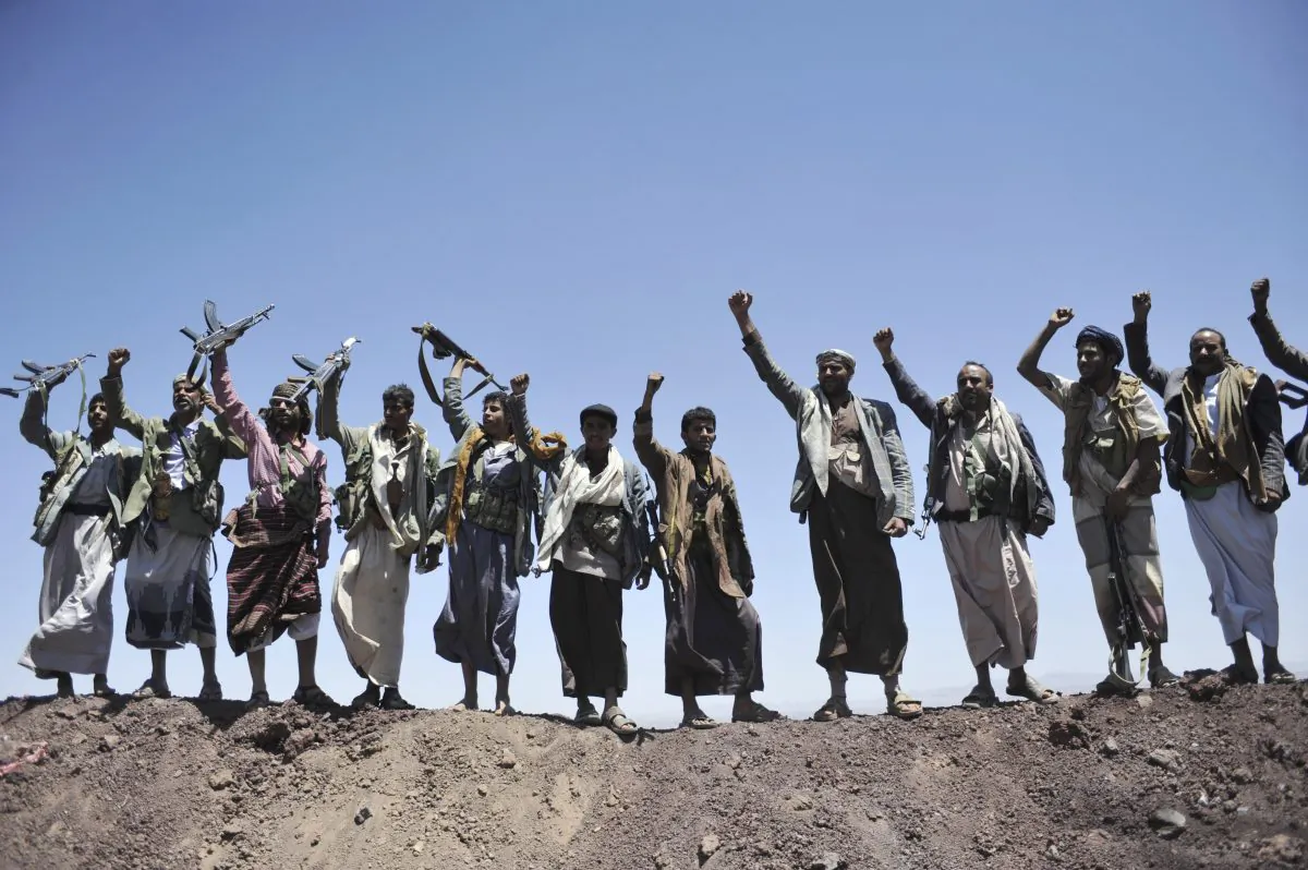 FILE - In this Sept. 22, 2014 file photo, Hawthi Shiite rebels chant slogans at the compound of the army's First Armored Division, after they took it over, in Sanaa, Yemen. The world celebrated the "Arab Spring" as evidence that the huddled masses of the Middle East, like people everywhere, are simply yearning to be free. But time has not been kind to the optimists. (AP Photo/Hani Mohammed, File)