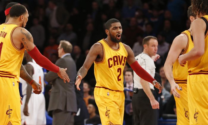 Cleveland Cavaliers guard Kyrie Irving (2) reacts while returning to the bench in the final minutes of the second half of an NBA basketball game against the New York Knicks in New York, Thursday, Dec. 4, 2014. The Cavaliers won 90-87. (AP Photo/Kathy Willens)