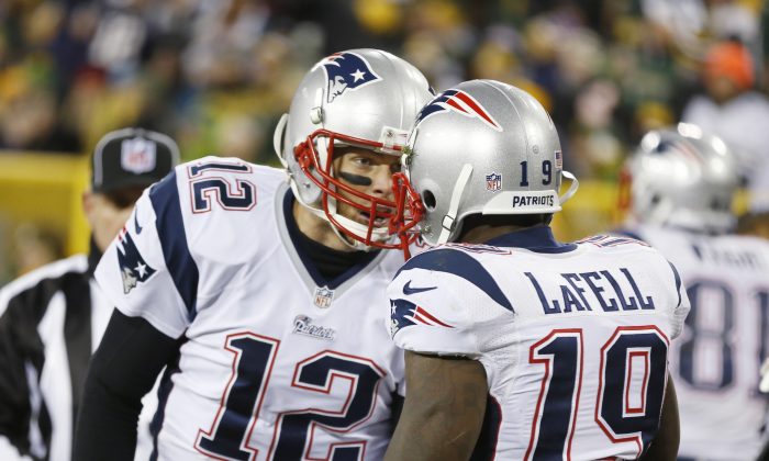 New England Patriots' Tom Brady (12) celebrates Brandon LaFell's touchdown catch during the second half of an NFL football game against the Green Bay Packers Sunday, Nov. 30, 2014, in Green Bay, Wis. (AP Photo/Tom Lynn)