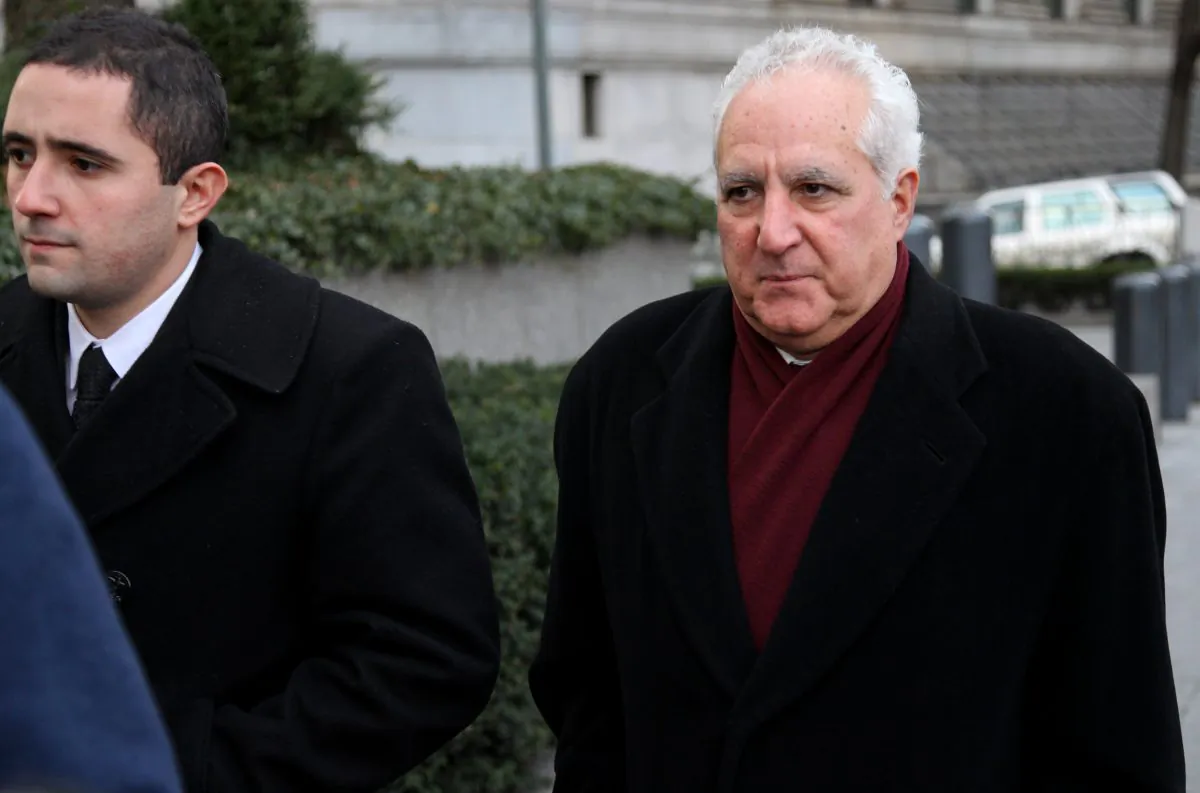In a Dec. 15, 2010 file photo, Daniel Bonventre, right, a former employee of Bernard Madoff, arrives before appearing in federal court in New York. Bonventre, the first of five ex-employees of imprisoned Ponzi king Bernard Madoff is scheduled to be sentenced Monday, Dec. 8, 2014 after a New York jury convicted them earlier this year. (AP Photo/Craig Ruttle, File)