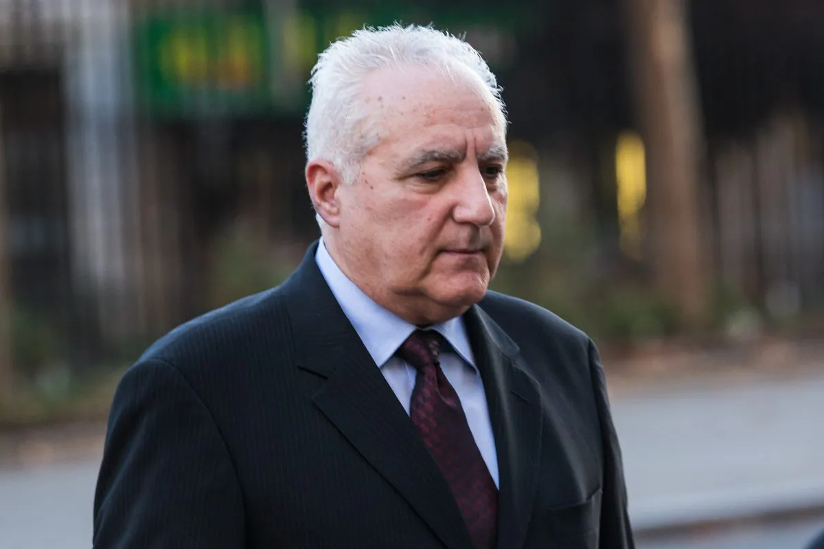 Daniel Bonventre (R) a former employee of Bernard Madoff, arrives before appearing in federal court in New York on Dec. 15, 2010. Bonventre, the first of five ex-employees of imprisoned Ponzi king Bernard Madoff was sentenced to 10 years in prison Monday, Dec. 8, 2014 after a New York jury convicted him earlier this year. (AP Photo/Craig Ruttle)