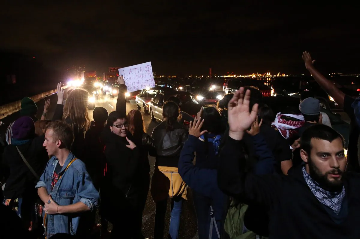 Protesters block interstate 80 during a demonstration over recent grand jury decisions in police-involved deaths on December 8, 2014 in Berkeley, California. (Justin Sullivan/Getty Images)