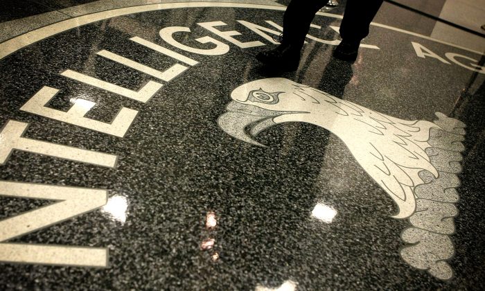  A man walks across the seal of the Central Intelligence Agency at the lobby of the Original Headquarters Building at the CIA headquarters February 19, 2009 in McLean, Virginia. (Alex Wong/Getty Images) 