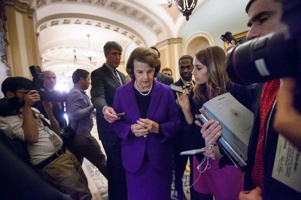 Senate Intelligence Committee Chair Sen. Dianne Feinstein (D-Calif.) is surrounded by reporters on Capitol Hill in Washington, Tuesday, Dec. 9, 2014, as she leaves the Senate chamber after releasing a report on the CIA's harsh interrogation techniques at secret overseas facilities. Feinstein branded the findings a "stain on the nation's history." (AP Photo/J. Scott Applewhite)