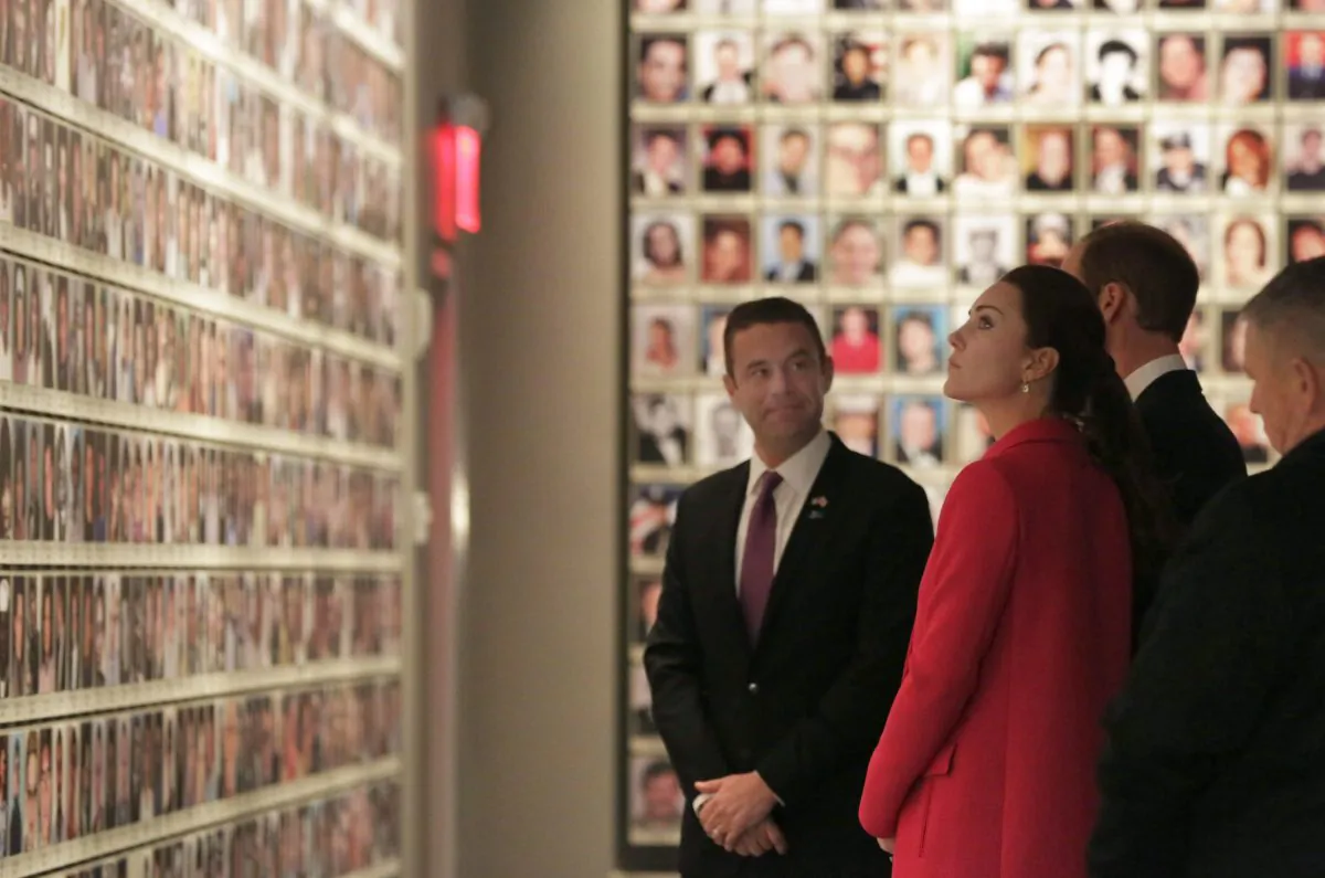 Kate, Duchess of Cambridge, and Britain's Prince William are escorted by Joe Daniels, president & CEO of the National September 11 Memorial & Museum in the Hall of Faces, during their visit to the National September 11 Museum, Tuesday, Dec. 9, 2014. Prince William and Kate are on the last of their 3-day tour of New York City, their first visit to the United States since a trip to California in 2011. (AP Photo/Richard Drew)