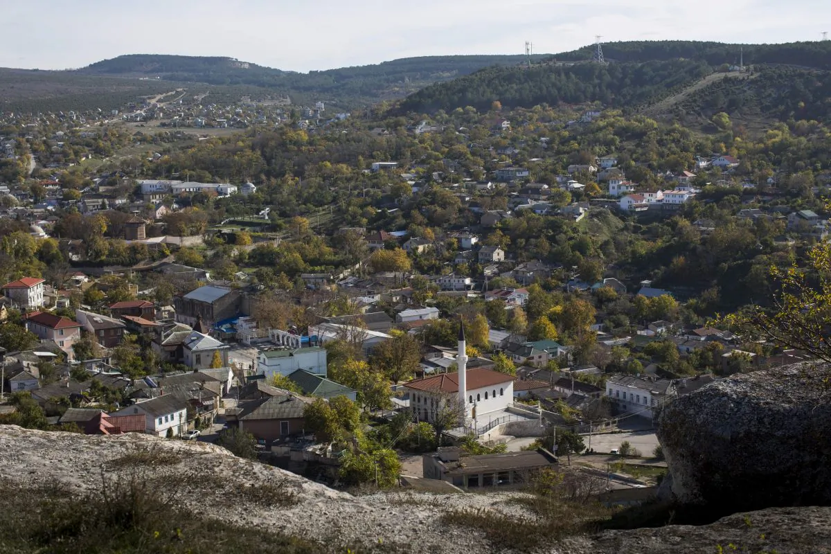 A view of Bakhchisarai, a city in central Crimea, a territory recognized by a majority of countries as part of Ukraine and incorporated by Russia as the Republic of Crimea, on Oct. 27, 201. Since Russia annexed Crimea from Ukraine, armed men have shown up frequently and at odd hours to search the cinder-block houses, mosque and school in this settlement of Tatars, a Muslim ethnic minority that has suffered a history of discrimination in the peninsula that is its historic homeland. (AP Photo/Alexander Zemlianichenko)