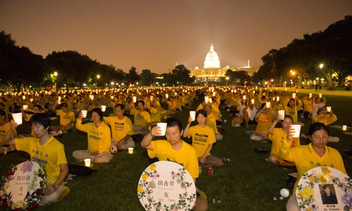 Falun Gong practitioners take part in a candlelight vigil in Washington, D.C., to raise awareness about the brutal persecution of their fellow practitioners in China. (Davids and Goliath)
