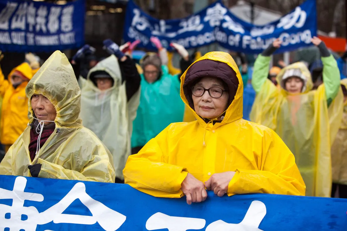 Falun Gong practitioners appeal for the end of persecution of their fellow practitioners in China on Human Rights Day in front of the United Nations offices in Manhattan, N.Y., on Dec. 10, 2014. (Petr Svab/Epoch Times)