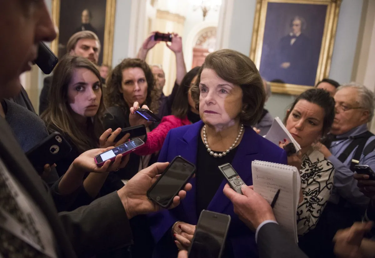 Senate Intelligence Chairwoman Dianne Feinstein (C), a Democrat from California, speaks to reporters about the committee's report on CIA interrogations at the US Capitol in Washington, DC, December 9, 2014 (Saul Loeb/AFP/Getty Images)
