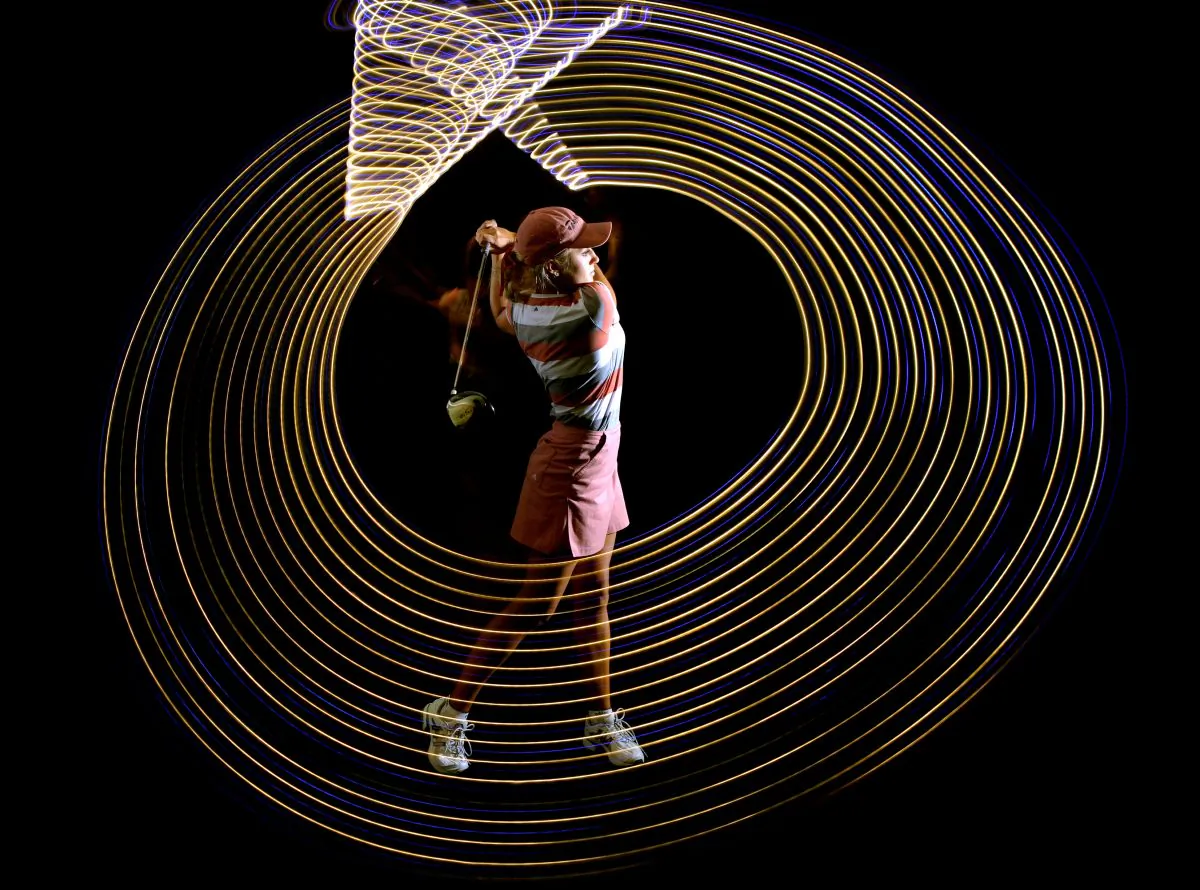 HENDERSON, NV - APRIL 21: Professional Golfer Natalie Gulbis shows the path of her golf swing in a long exposure shot during a Calendar Shoot at the Lake Las Vegas Resort on April 21, 2004 in Henderson Nevada. (Donald Miralle/Getty Images)