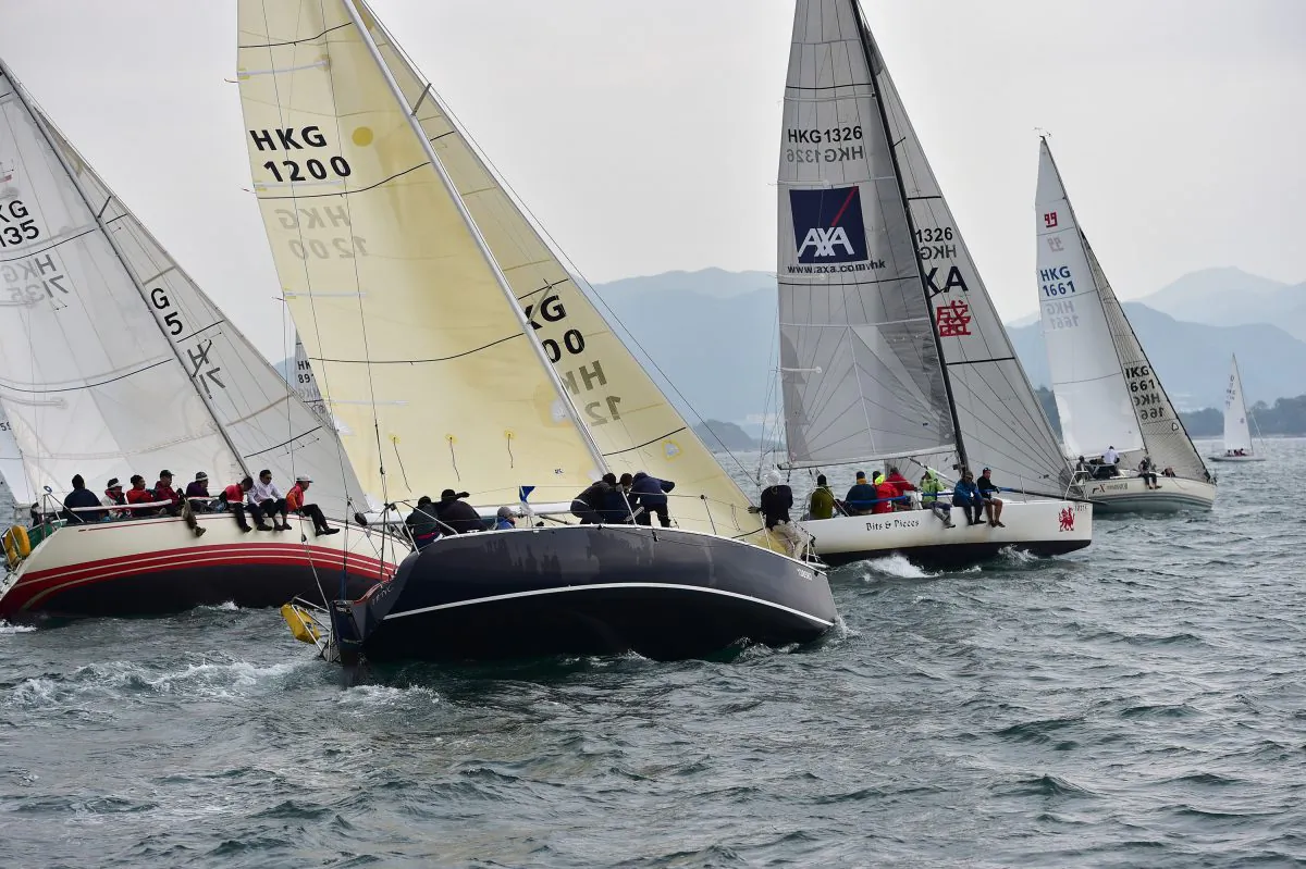 HKPN Boats ‘Applause’ (1200), ‘Getafix’, ‘Bits & Pieces’ and ‘X-Terminator’ line up for the start of Race-5, the first race on Day-3 of the Hebe Haven Yacht Club, UK Sailmakers Winter Saturday Series on Saturday Dec. 6, 2014. (Bill Cox/Epoch Times)