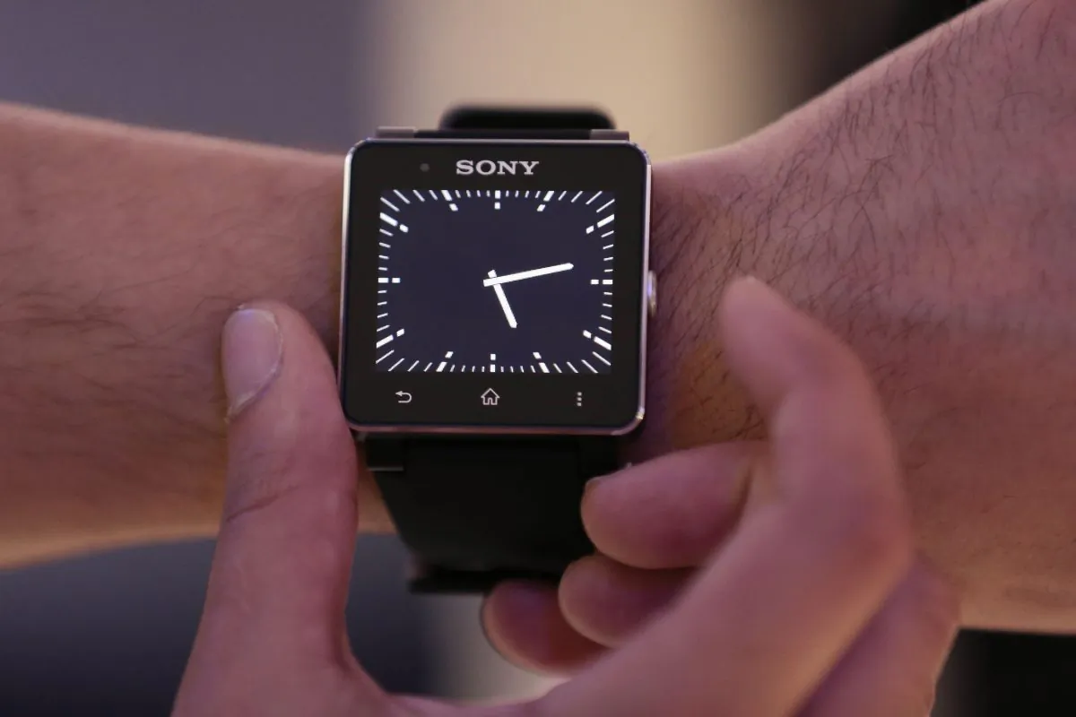 A man shows a Sony Smart Watch II at a Sony event ahead of the IFA, one of the world's largest trade fairs for consumer electronics and electrical home appliances in Berlin, Wednesday, Sept. 4, 2013. (Markus Schreiber/AP Photo)