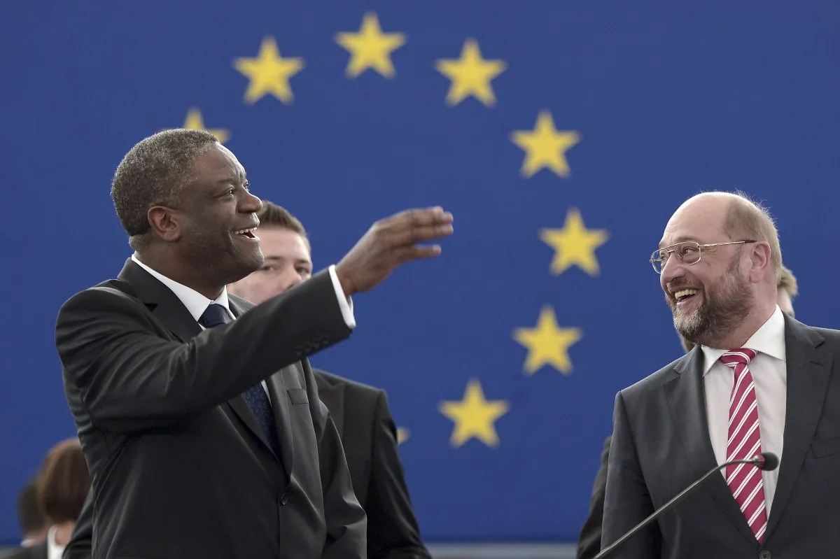 Congolese gynecologist, specialized in treating victims of rape and extreme sexual violence, Denis Mukwege (L), next to European Parliament President Martin Schulz after receiving the prestigious Sakharov human rights prize for his work in helping thousands of rape victims in the Democratic Republic of the Congo on Nov.26, 2014 at the European Parliament in Strasbourg, France. (Frederick Florin/AFP/Getty Images)