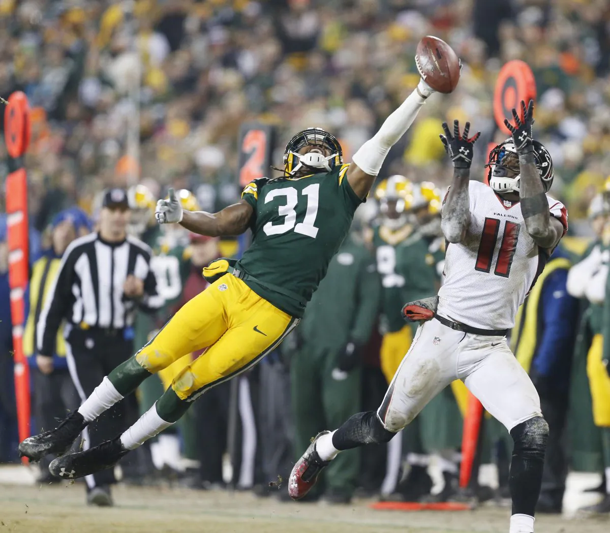 Green Bay Packers' Davon House breaks up a pass intended for Atlanta Falcons' Julio Jones during the second half of an NFL football game Monday, Dec. 8, 2014, in Green Bay, Wis. (AP Photo/Mike Roemer)