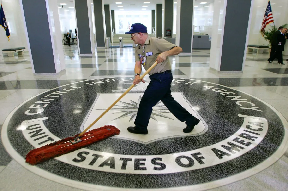 In this March 3, 2005 file photo, a workman literally cleans house at the Central Intelligence Agency headquarters in Langley, Va. (AP Photo/J. Scott Applewhite)