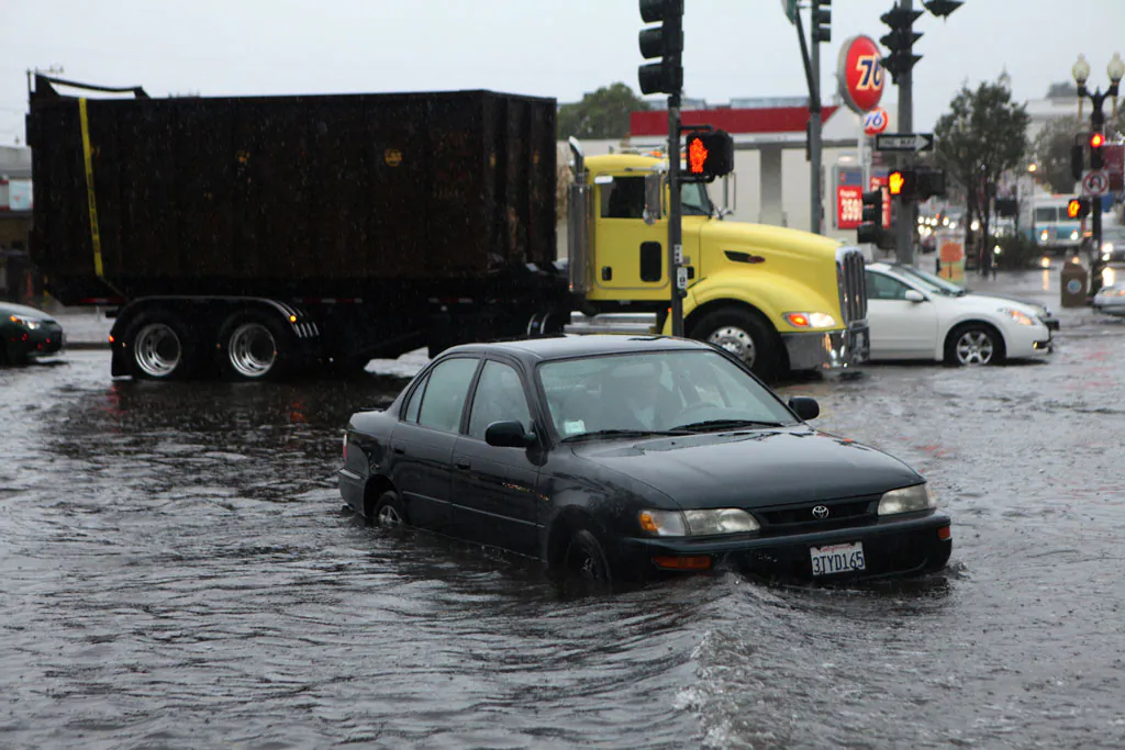 Mark Kunze of San Bruno stalls his car in the flooded intersection of Airport Blvd. and Grand Ave., in South San Francisco, on Thursday, Dec. 11, 2014. Several vehicles stalled in and around the intersection after driving through the deep water. A powerful storm churned through the San Francisco Bay Area on Thursday, knocking out power to tens of thousands and delaying commuters while bringing a soaking of much needed rain. (AP Photo/Alex Washburn)