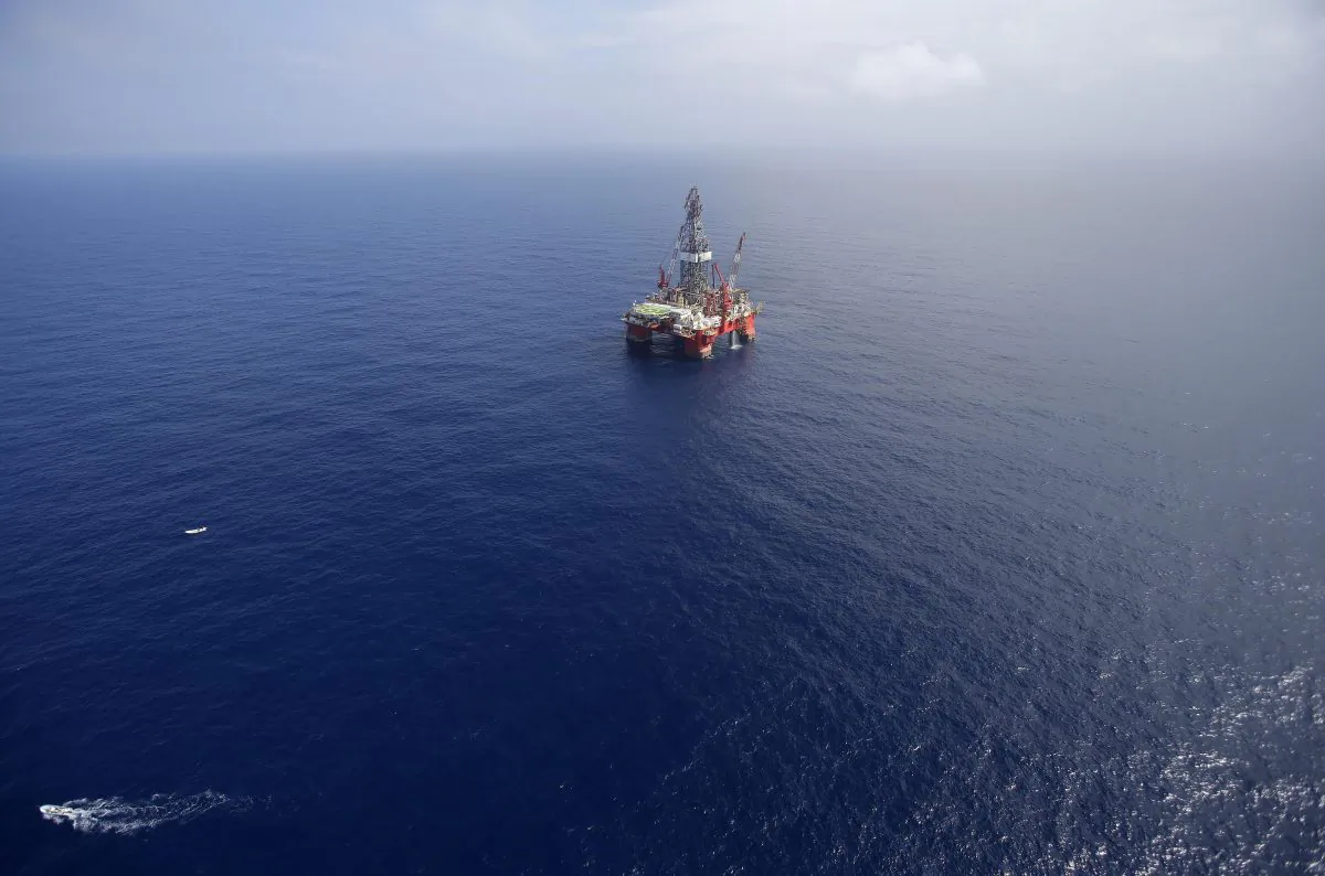 The Centenario deep-water drilling platform stands off the coast of Veracruz, Mexico in the Gulf of Mexico, on Nov. 22, 2013. Mexico's government announced on Thursday, Dec. 11, 2014, the start of bidding for oil exploration rights in 14 areas of the Gulf of Mexico being opened to domestic and international companies as it ends a seven-decade state monopoly on the petroleum business. (AP Photo/Dario Lopez-Mills)