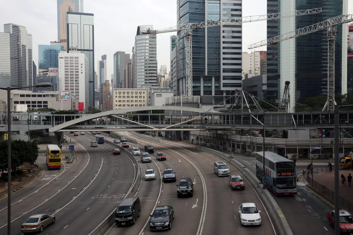 Traffic passes down a main thoroughfare of Hong Kong's Admiralty district on December 12, 2014 the day after police cleared away the main pro-democracy protest site. (Isaac Lawrence/AFP/Getty Images)