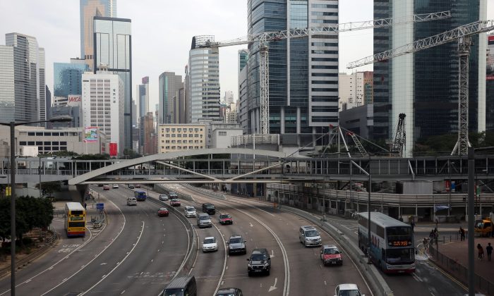 Traffic passes down a main thoroughfare of Hong Kong's Admiralty district on December 12, 2014 the day after police cleared away the main pro-democracy protest site. (Isaac Lawrence/AFP/Getty Images)