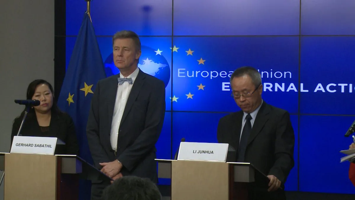 Gerhard Sabathil (L), director for East Asia and the Pacific in the European External Action Service (EEAS) and Li Junhua, director general for International Organizations and Conferences, Ministry of Foreign Affairs of the People's Republic of China hold a joint press conference after the 33rd human rights dialogue at the headquarters of the EEAS in Brussels on Dec. 8, 2014.