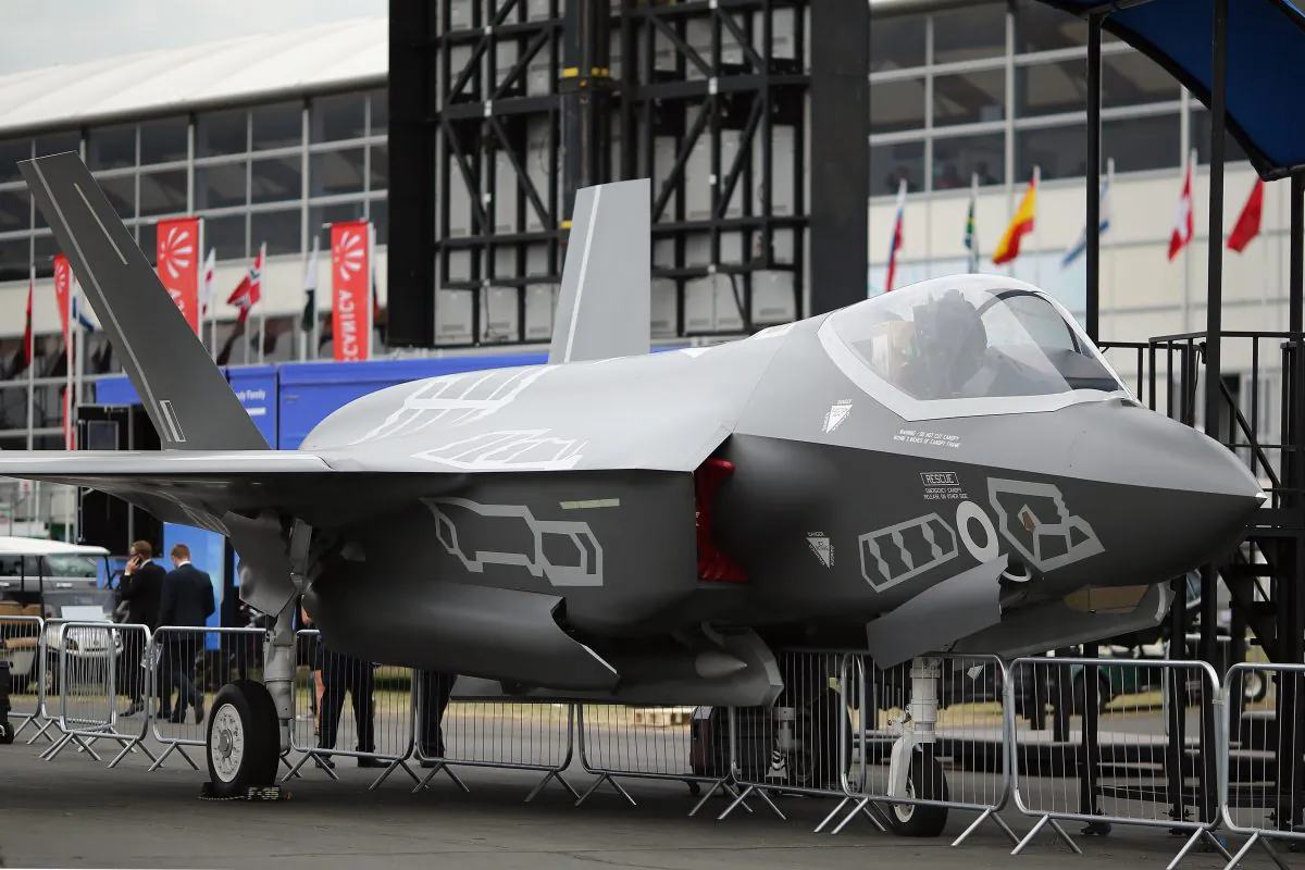  A model of a Lockhead Martin F-35 on display during an airshow on July 16 in Farnborough, England. A Chinese national is being charged in the United States for allegedly stealing and trying to transfer new F-35 designs to China. (Dan Kitwood/Getty Images)