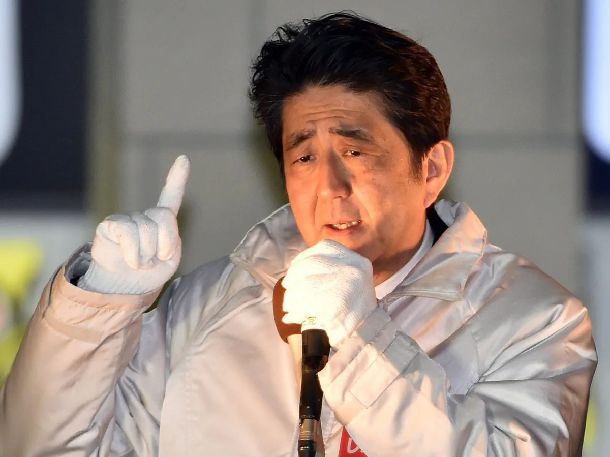 Japanese Prime Minister and ruling Liberal Democratic Party (LDP) leader Shinzo Abe delivers a campaign speech for the upcoming general election before his party supporters at Omiya, Tokyo, on Dec.  9, 2014. (Yoshikazu Tsuno/AFP/Getty Images)