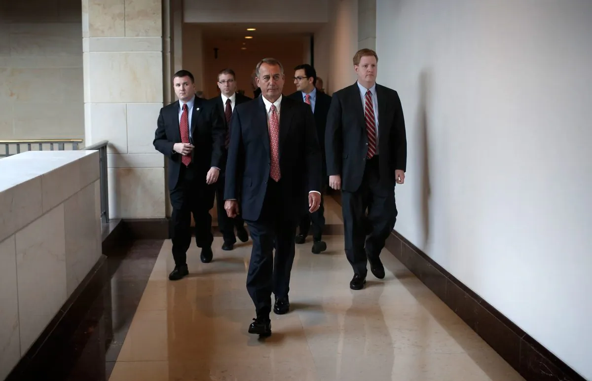 U.S. Speaker of the House John Boehner (R-OH) departs a press conference at the U.S. Capitol on Dec. 11, 2014.. During the press conference Boehner said if the government funding bill is not passed by the House today “we are going to be here until Christmas.” (Win McNamee/Getty Images)