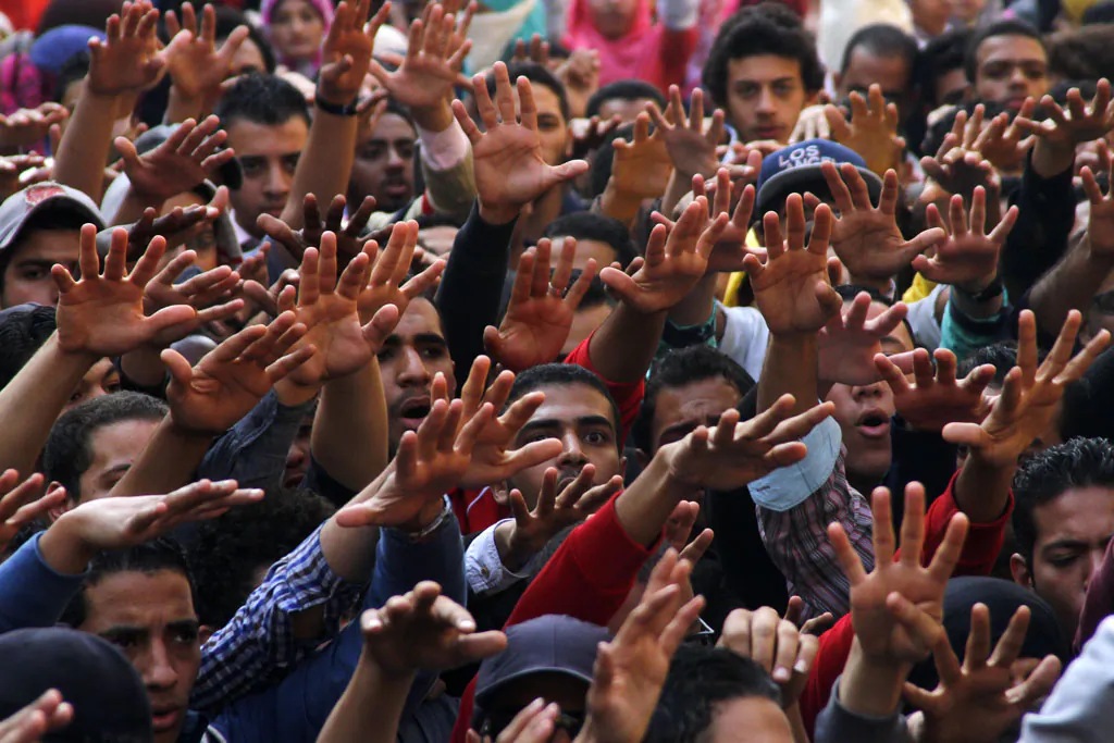 A group of students protest against the dismissal of the murder case against toppled President Hosni Mubarak over the killing of protesters during Egypt’s 2011 uprising, at Cairo University, Cairo, Egypt, Sunday, Nov. 30, 2014. Judge Mahmoud al-Rashidi dismissed the case on a technicality, saying Mubarak’s referral to prosecution ignored an earlier decision by prosecutors not to try him. Al-Rashidi did, however, find Mubarak’s security chief and six of his top aides not guilty on charges of ordering the killings, a ruling that implicitly absolves Mubarak. (AP Photo/Ravy Shaker, El Shorouk newspaper)
