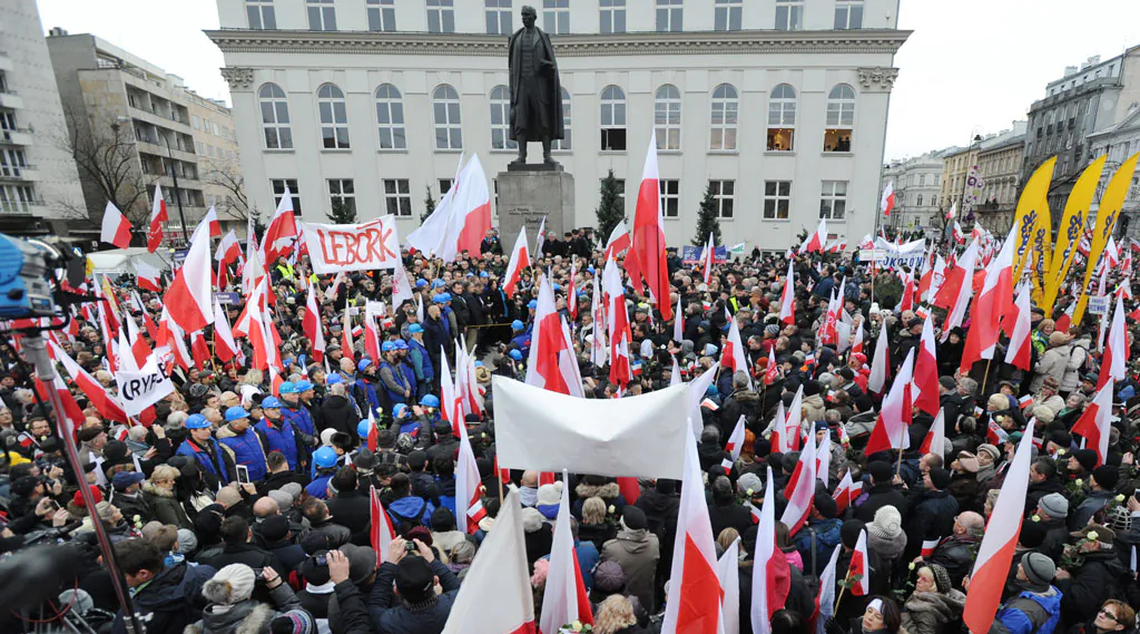 Thousands of supporters of the main opposition party, the conservative Law and Justice, gather at the Three Crosses square in Warsaw, Poland, Saturday, Dec. 13, 2014. (AP Photo/Alik Keplicz)