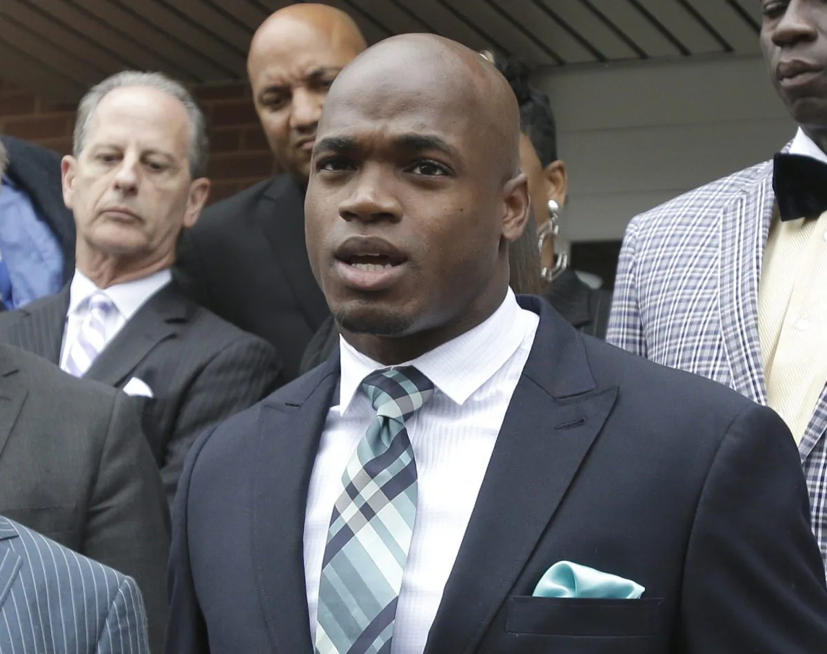 FILE - In this Nov. 4, 2014, file photo, Minnesota Vikings running back Adrian Peterson speaks to the media after pleading no contest to an assault charge in Conroe, Texas. On Friday, Dec. 12, 2014, the league-appointed arbitrator for Peterson's appeal affirmed his unpaid suspension until at least next spring, the final result of a child-abuse case that kept the Minnesota Vikings running back out of all but one game this season and widened the rift between the NFL and its players over the fairness of the disciplinary process. (AP Photo/Pat Sullivan, File)