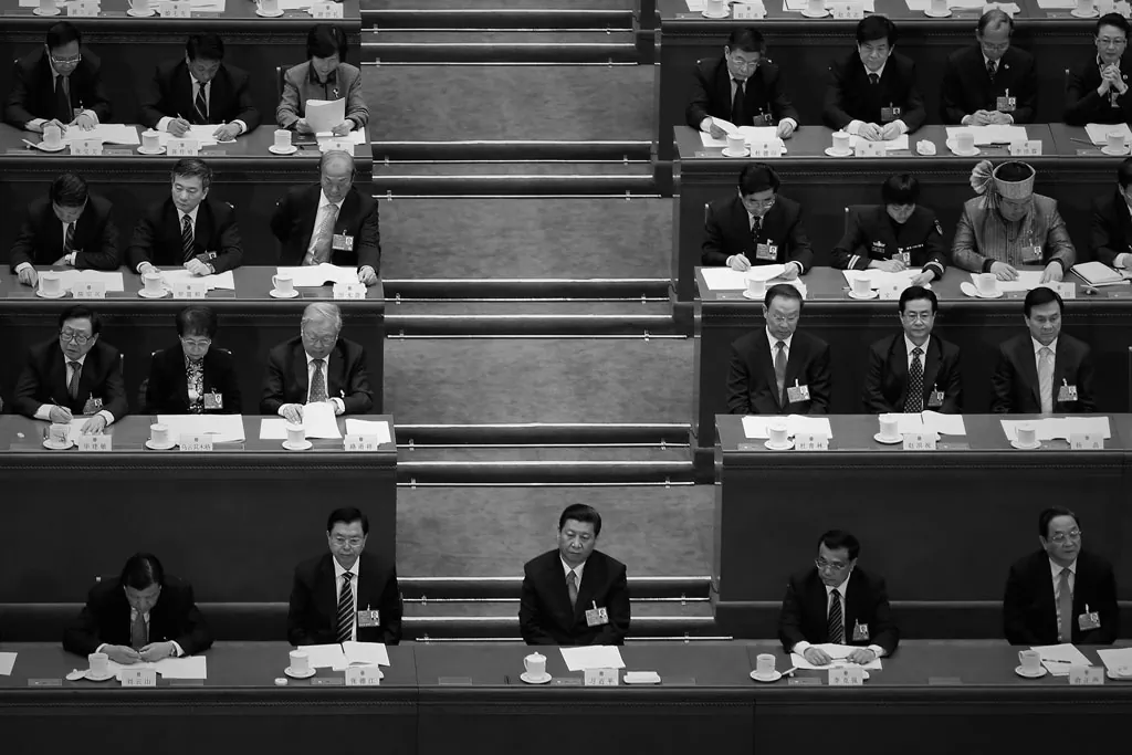 Chinese Communist Party General Secretary Xi Jinping (C), with Chairman of the Standing Committee of the National People's Congress Zhang Dejiang (2nd L), Premier Li Keqiang (2nd R) and incoming-Chairman of Chinese People's Political Consultative Conference Yu Zhengsheng (R) at a political meeting in Beijing in March 2013. Cyber attacks were launched against the Epoch Times Chinese website recently, during the purge of Party official Zhou Yongkang. (Feng Li/Getty Images)