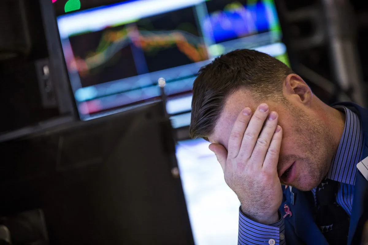 A trader reacts on the floor of the New York Stock Exchanged after the Dow Jones Industrial Average took plunged over 250 points on Dec. 10, 2014. (Andrew Burton/Getty Images)