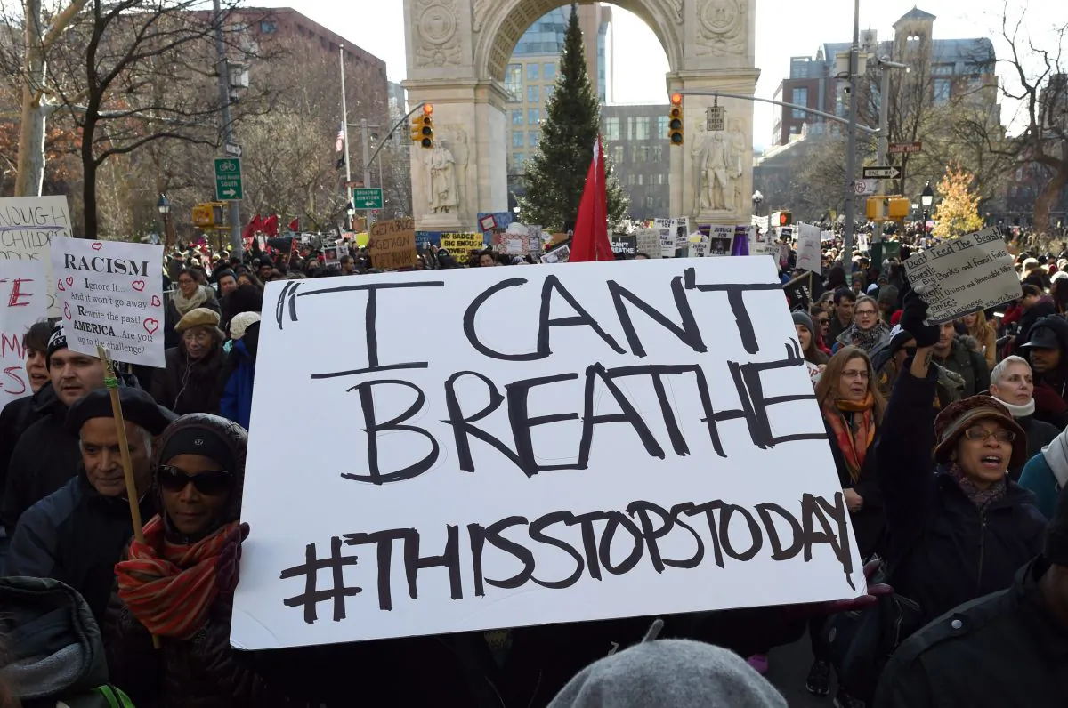 Protesters march on 5th Avenue during the Millions March NYC on December 13, 2014 in New York. Thousands of people marched in Washington and New York on Saturday to demand justice for black men who have died at the hands of white police, the latest in weeks of demonstrations across the United States.    (Don Emmeret/AFP/Getty Images)