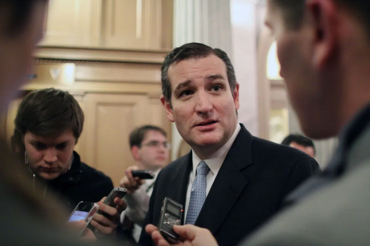 Sen. Ted Cruz (R-TX) talks with reporters after the Senate voted on a $1.1 trillion spending bill to fund the government through the next fiscal year on on Saturday, Dec. 13, 2014 on Capitol Hill in Washington. (AP Photo/Lauren Victoria Burke)