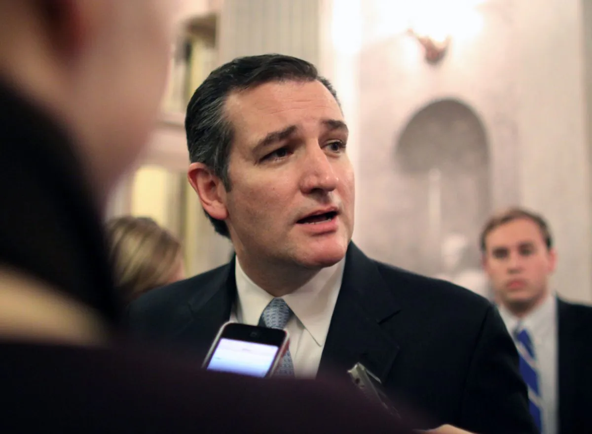 Sen. Ted Cruz (R-TX) talks with reporters after the Senate voted on a $1.1 trillion spending bill to fund the government through the next fiscal year on on Saturday, Dec. 13, 2014 on Capitol Hill in Washington. (AP Photo/Lauren Victoria Burke)