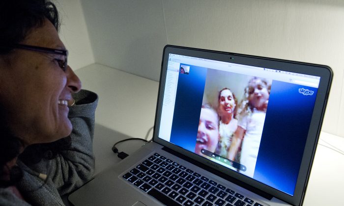 A woman communicates with her family abroad by using the Internet telephone system Skype in Stockholm, Sweden, on Aug. 26, 2013. (Jonathan Nackstrand/AFP/Getty Images)