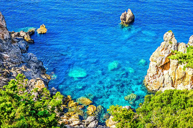 Cliffside coastline on Greek island Corfu via Shutterstock*