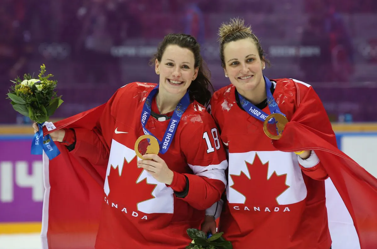 Gold medalists Catherine Ward (L) and Marie-Philip Poulin celebrate their incredible gold medal victory over the U.S. on Feb. 20, 2014 in Sochi, Russia. (Bruce Bennett/Getty Images)
