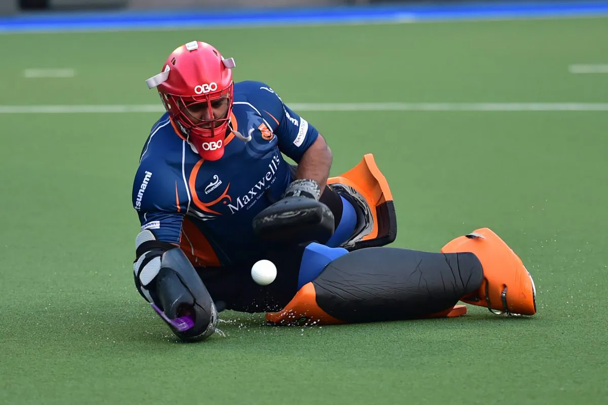 Khalsa-A’s goalie made many important blocks and saves in their HKHA Premier Division match against Punjab-A at King’s Park on Sunday Dec. 14, 2014. (Bill Cox/Epoch Times)