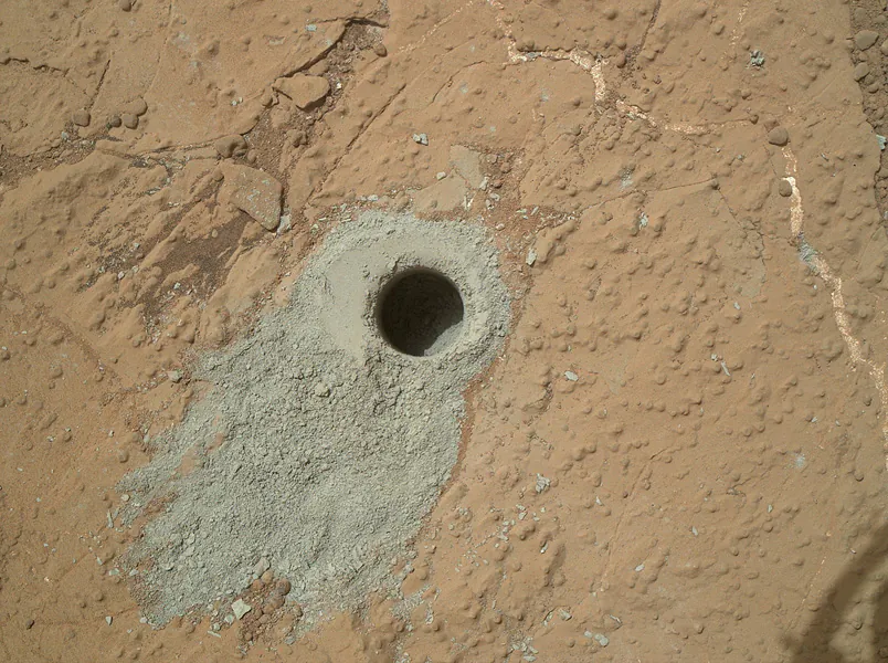 The first definitive detection of Martian organic chemicals in material on the surface of Mars came from analysis by NASA's Curiosity Mars rover of sample powder from this mudstone target, "Cumberland."(NASA/JPL-Caltech/MSSS)