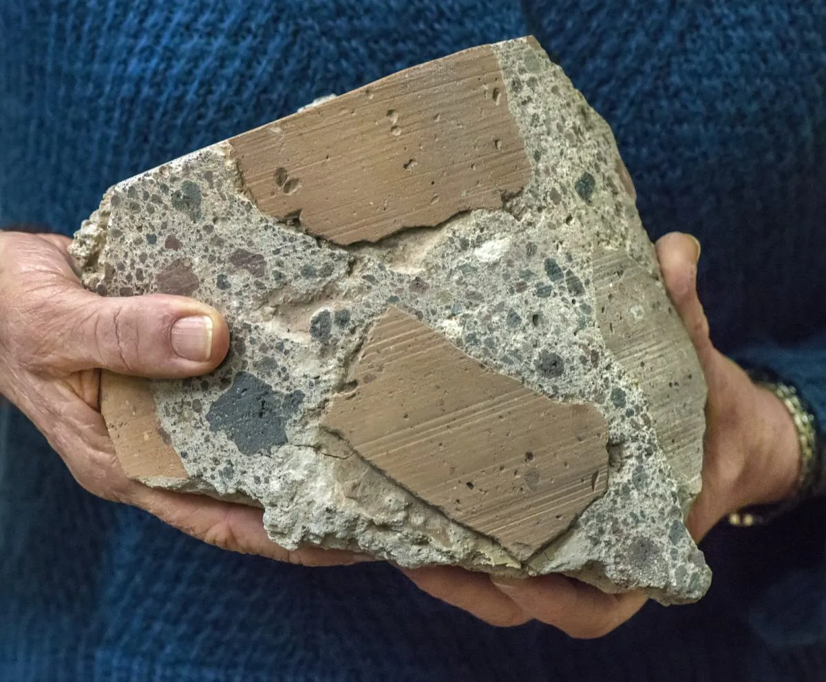 Ancient Roman concrete consists of coarse chunks of volcanic tuff and brick bound together by a volcanic ash-lime mortar that resists microcracking, a key to its longevity and endurance. (Roy Kaltschmidt, Berkeley Lab)