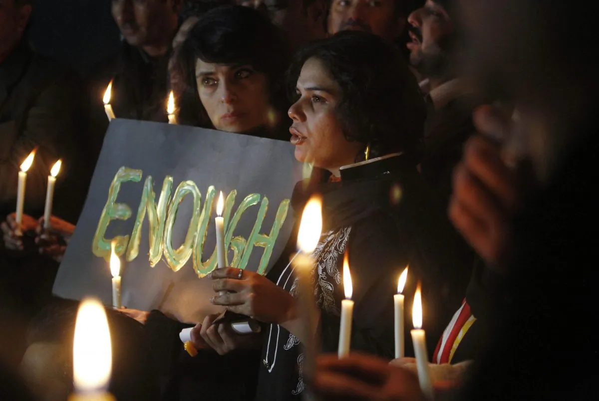 Pakistani civil society members take part in a candle light vigil for the victims of a school attacked by the Taliban in Peshawar, Tuesday, Dec. 16, 2014 in Islamabad, Pakistan. (AP Photo/Anjum Naveed)