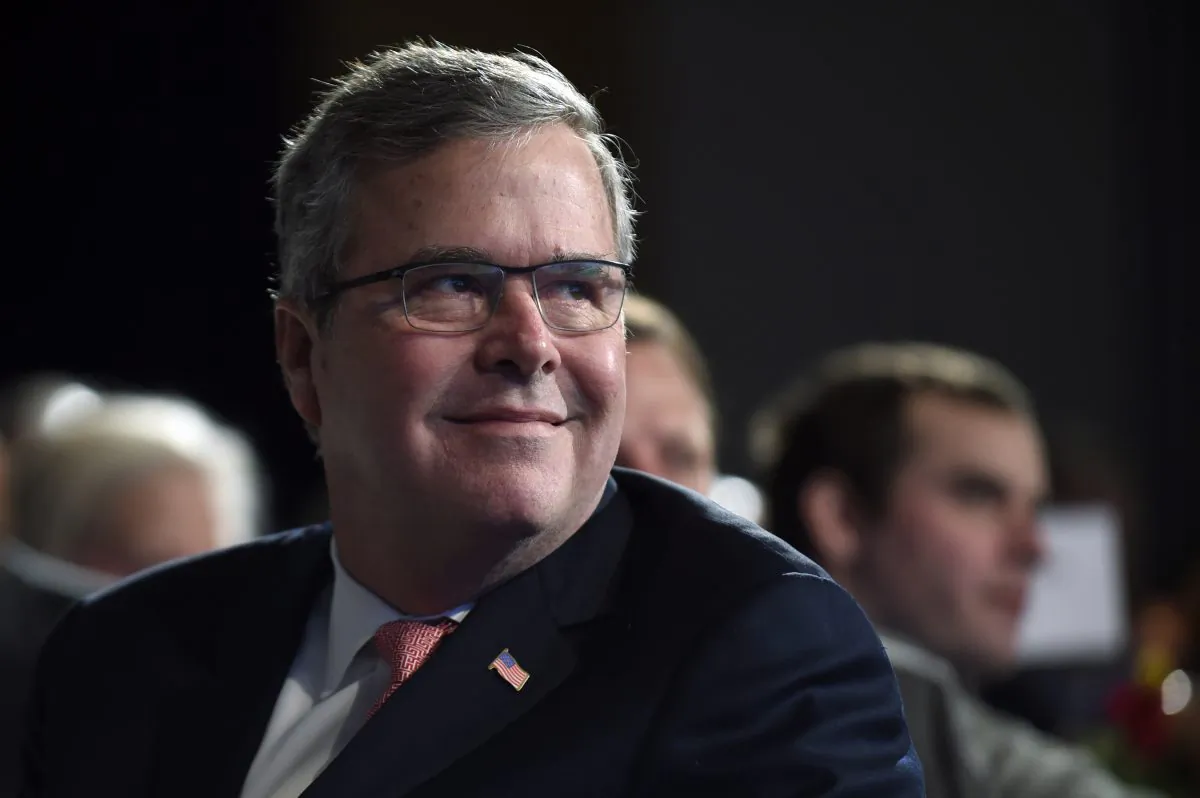 In this Nov. 20, 2014 file photo, Jeb Bush listens before speaking at the National Summit on Education Reform in Washington. (AP Photo/Susan Walsh, File)