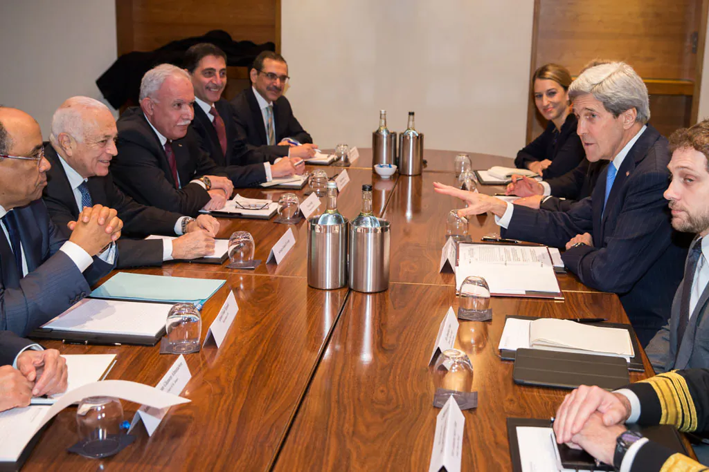 US Secretary of State John Kerry (2L) meets with Arab League secretary general Nabil El-Arabi (2L) on Tuesday, Dec. 16, 2014, in London. The meeting was to discuss the ongoing peace process between the Israelis and Palestinians. (AP Photo/Evan Vucci)