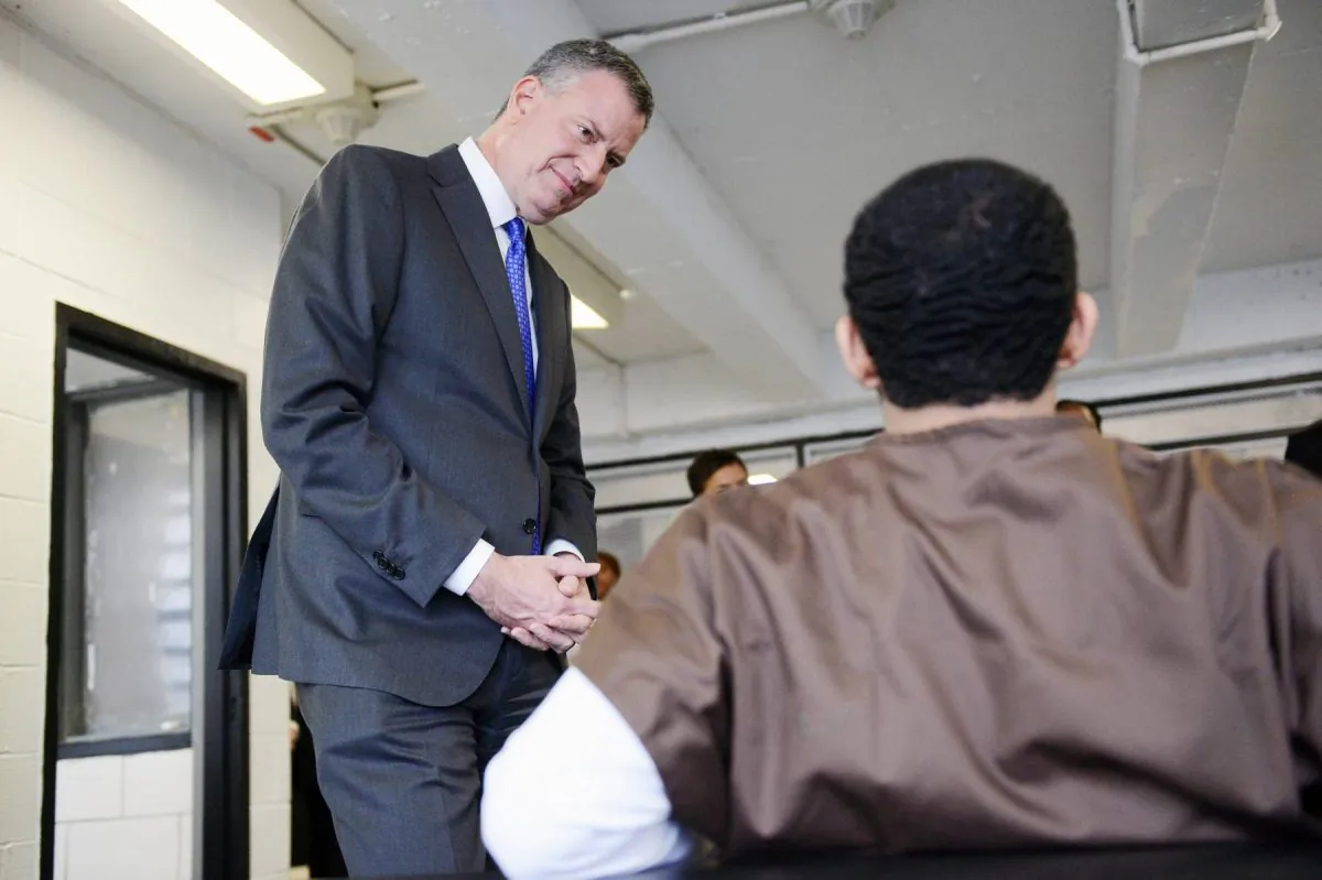 New York City mayor Bill de Blasio speaks with youth incarcerated at the Robert N. Davoren Center, a facility within the city's Rikers Island jail complex, during a visit on Wednesday, Dec. 17, 2014. (New York Daily News)