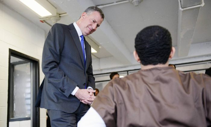New York City mayor Bill de Blasio speaks with youth incarcerated at the Robert N. Davoren Center, a facility within the city's Rikers Island jail complex, during a visit on Wednesday, Dec. 17, 2014. (New York Daily News)