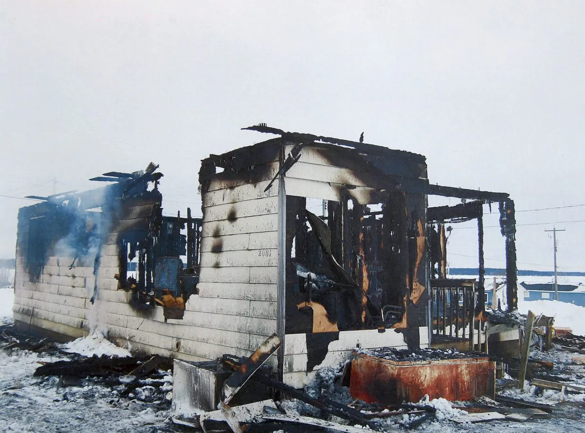 A burned-out house in St. Theresa Point First Nation, Man., in January 2011. A former band constable who rescued a toddler from a burning home on the reserve says he’s haunted by a baby he wasn’t able to save who perished in the fire. (The Canadian Press/HO, RCMP via Manitoba Law Courts)