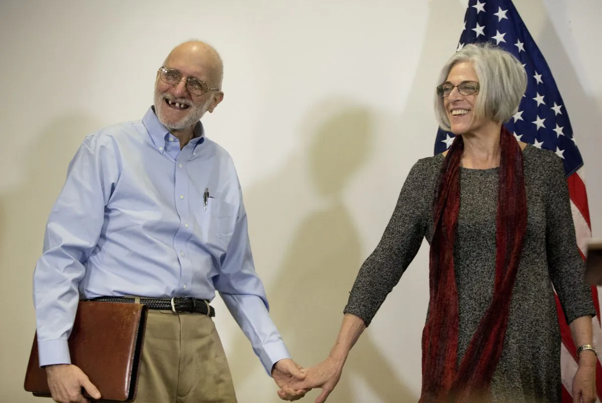 Alan Gross, released after five years in a Cuban prison, smiles as he and his wife Judy arrive for a news conference in Washington on Dec. 17, 2014. The White House is thankful to Canada for hosting secret meetings that led to the re-establishment of relations between the U.S. and Cuba. (AP Photo/Pablo Martinez Monsivais)