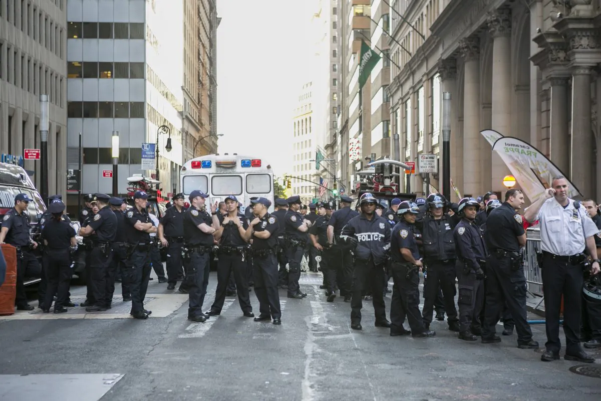 NYPD officers at the intersection of Wall St. and Broadway in New York on Sept. 22, 2014. (Samira Bouaou/Epoch Times)