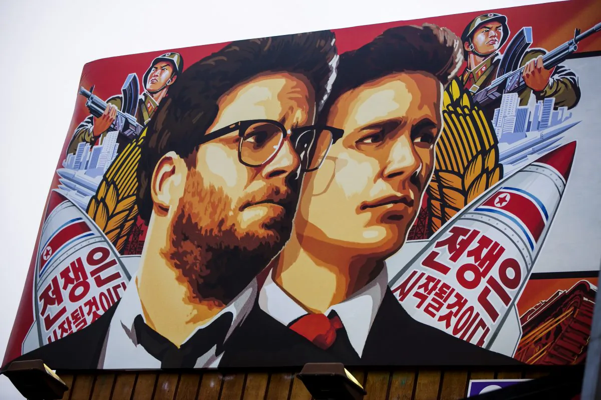 A banner for "The Interview"is posted outside Arclight Cinemas, Wednesday, Dec. 17, 2014, in the Hollywood section of Los Angeles. A U.S. official says North Korea perpetrated the unprecedented act of cyberwarfare against Sony Pictures that exposed tens of thousands of sensitive documents and escalated to threats of terrorist attacks that ultimately drove the studio to cancel all release plans for "The Interview." (AP Photo/Damian Dovarganes)